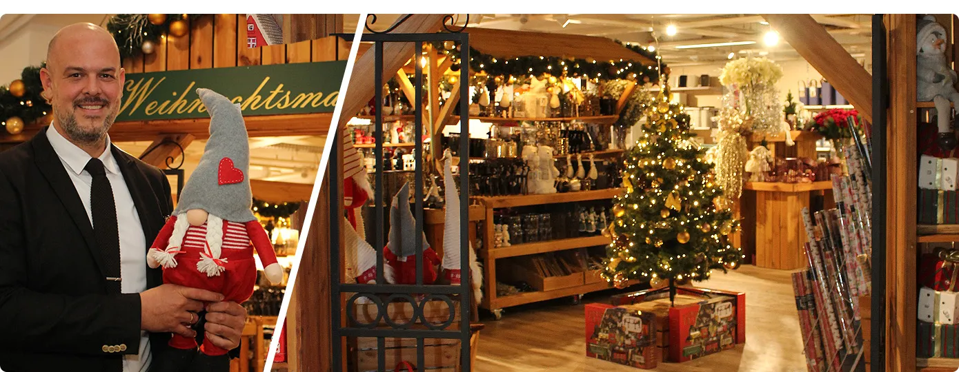 Großer Weihnachtsmarkt in Bad Segeberg, Hausleiter Herr Werner steht vor Eingang und hält einen Wichtel in der Hand