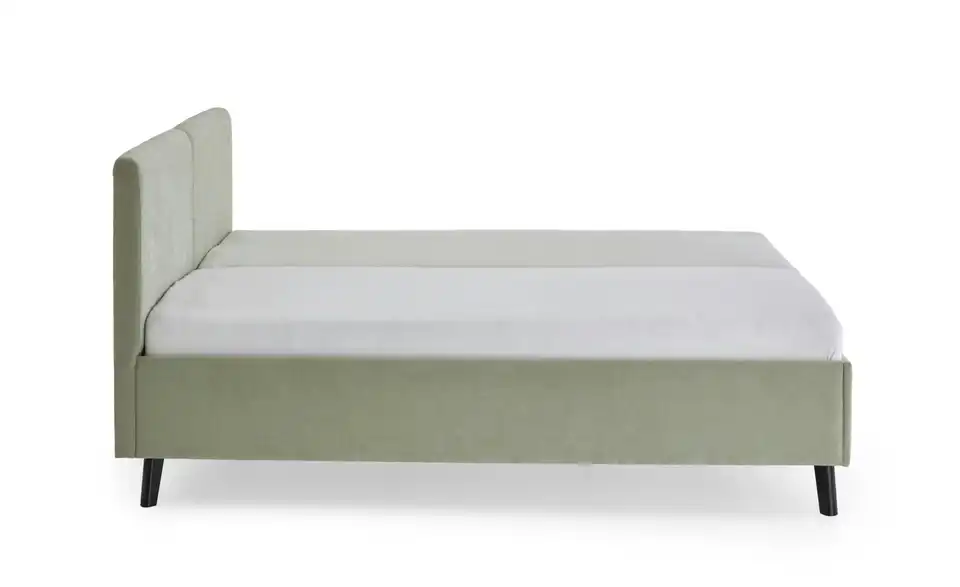 Polsterbett in hellgrün, Profilansicht