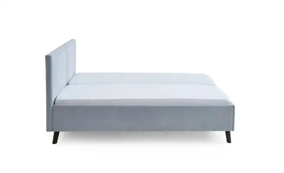 Polsterbett in hellblau, Profilansicht