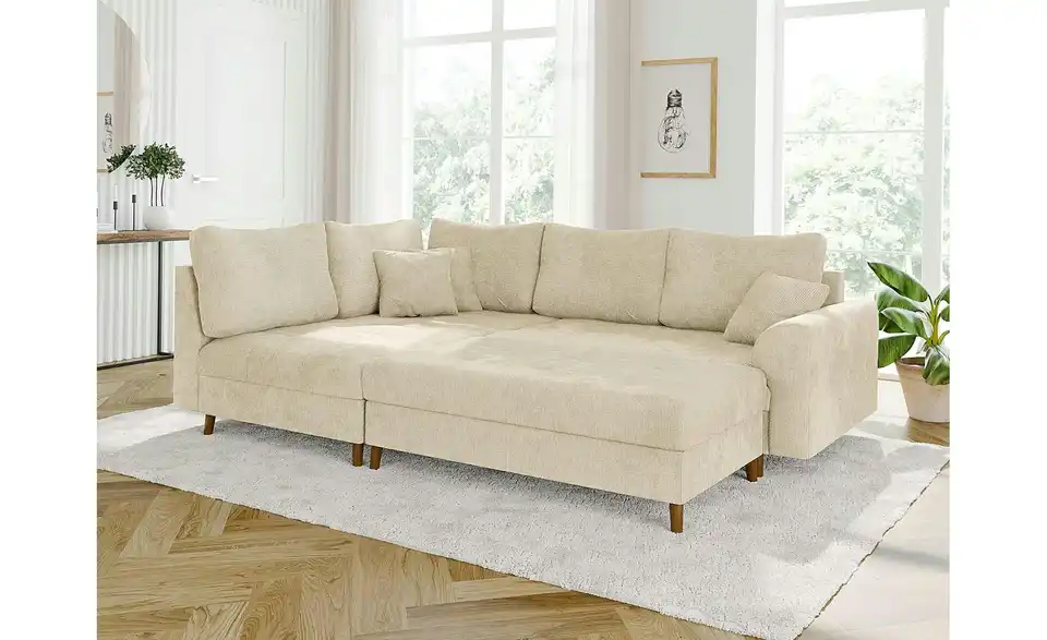 Ecksofa mit Hocker, in Wohnsituation
