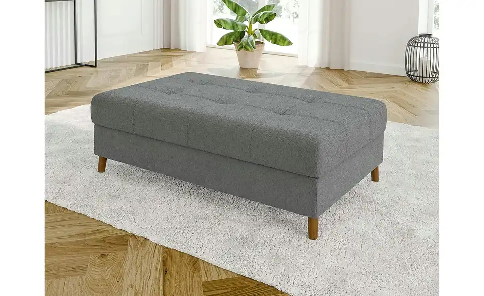 Ecksofa mit Hocker, in Wohnsituation