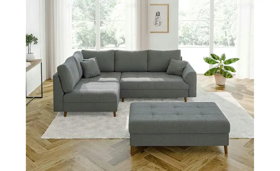 Ecksofa mit Hocker, in Wohnsituation